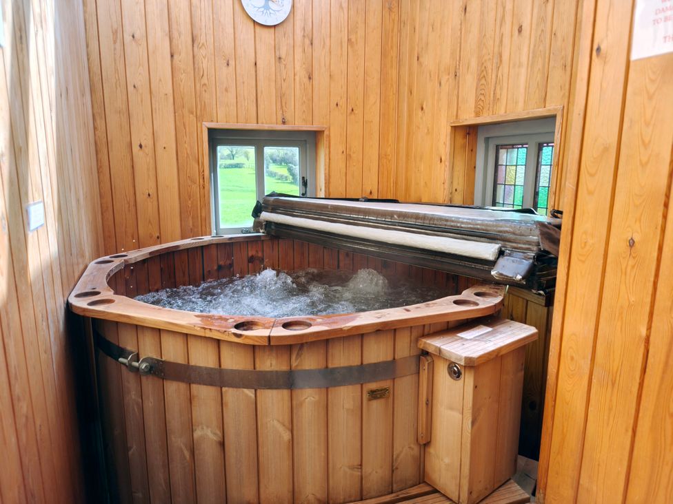 A hot tub in a wooden room at Kaber Chapel near Kirby Stephen