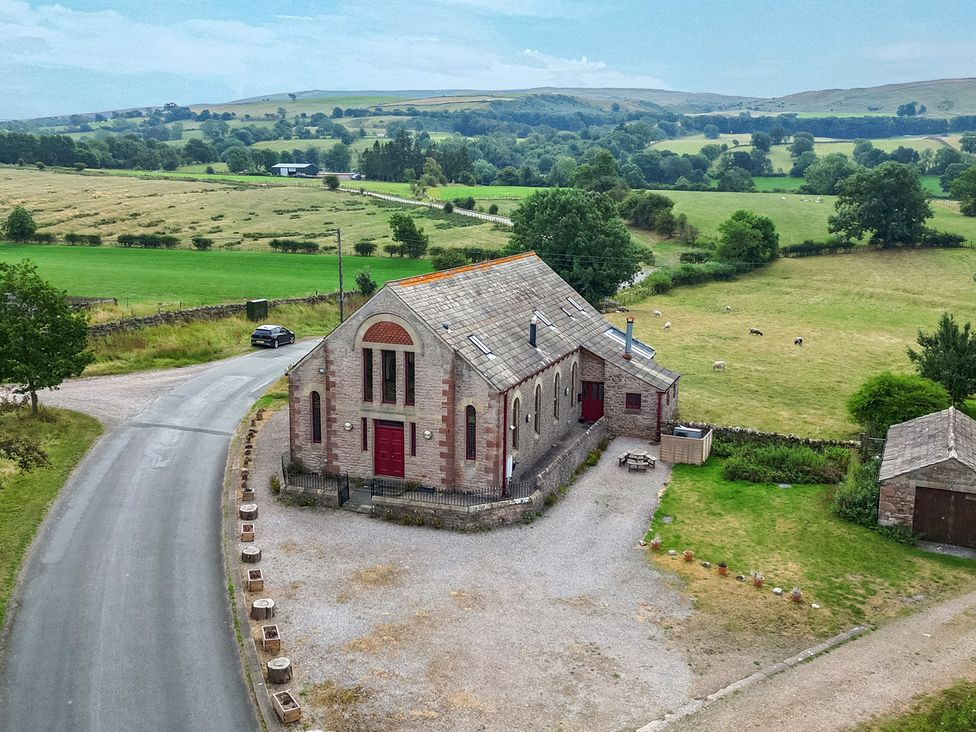 An exterior view of a building with surrounding landscape at Kaber Chapel in Kaber near Kirkby Stephen
