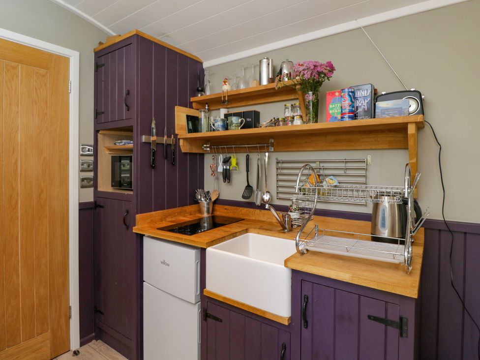 A kitchen with a sink and countertop at Valley View Shepherd's Hut in South Molton