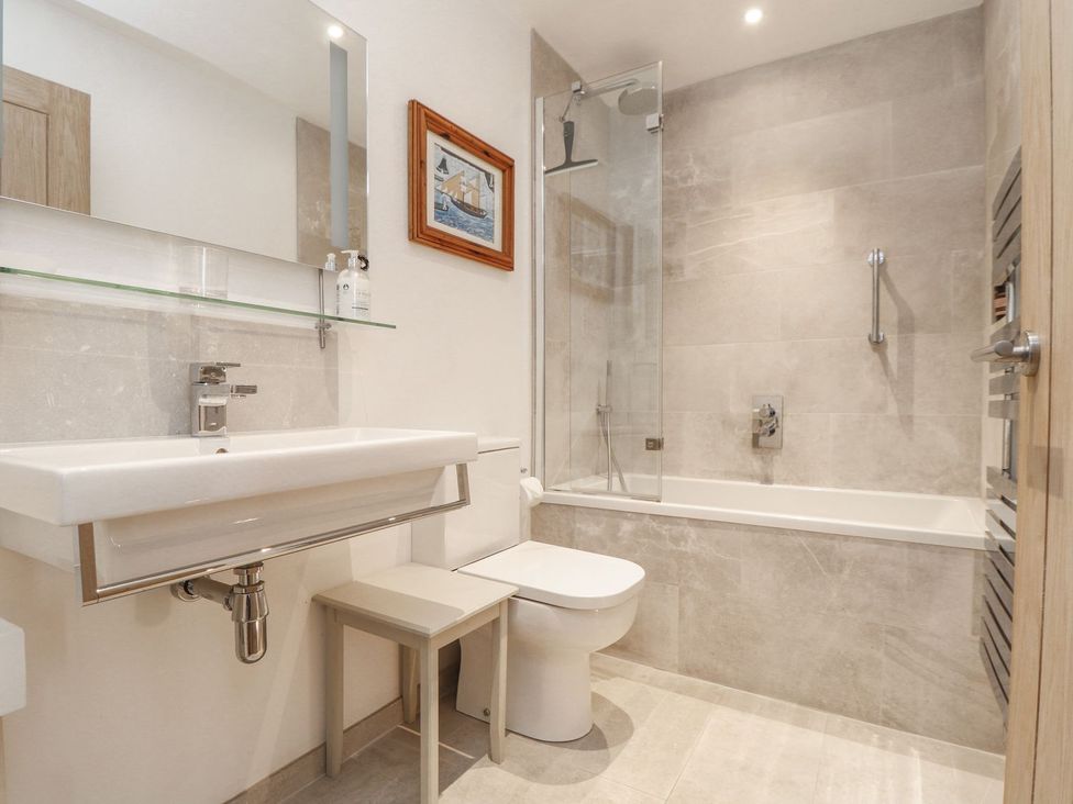 A bathroom with sink toilet and shower at Wood Meadow in Helston
