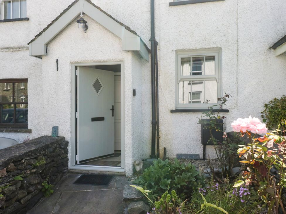 An entrance with a front door and flowers at Bobbin Nook