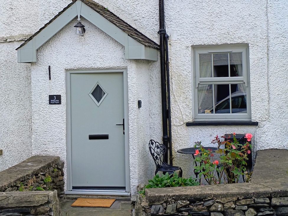 An entrance with a door and flowers at Bobbin Nook in Staveley