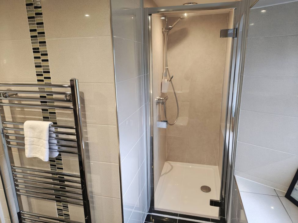 A shower with a towel rail in a bathroom at Bobbin Nook in Staveley