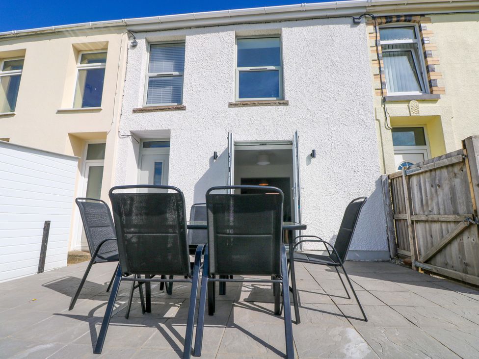 An outdoor dining area with seating at Mountain View Cottage in Ystradgynlais