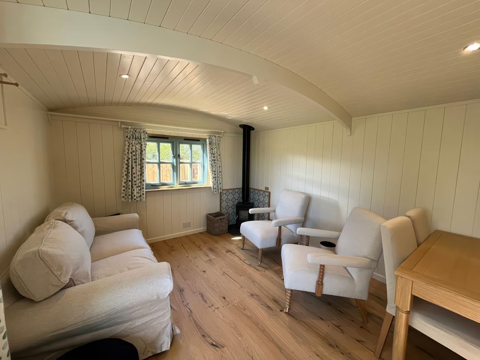 A living room with a sofa and armchairs at The Orchard in Ringstead
