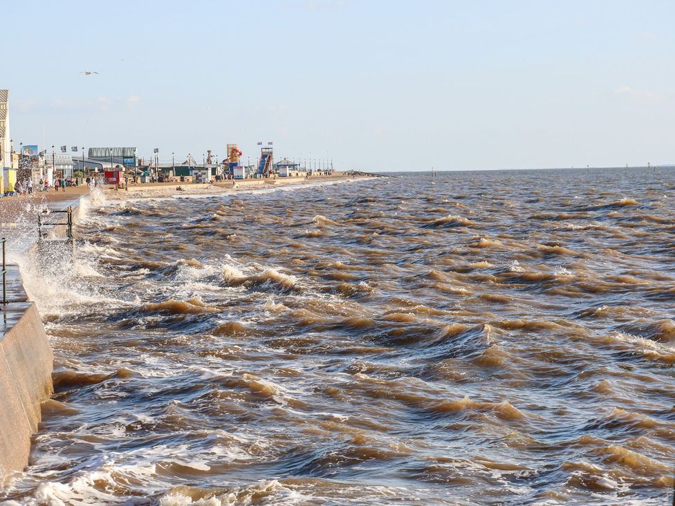A view of the sea and shoreline at Hideaway Cottage in Hunstanton