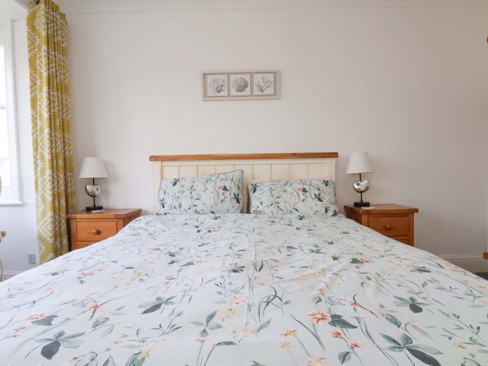 A bedroom with a bed and bedside tables at 11 Peasholm Avenue Scarborough