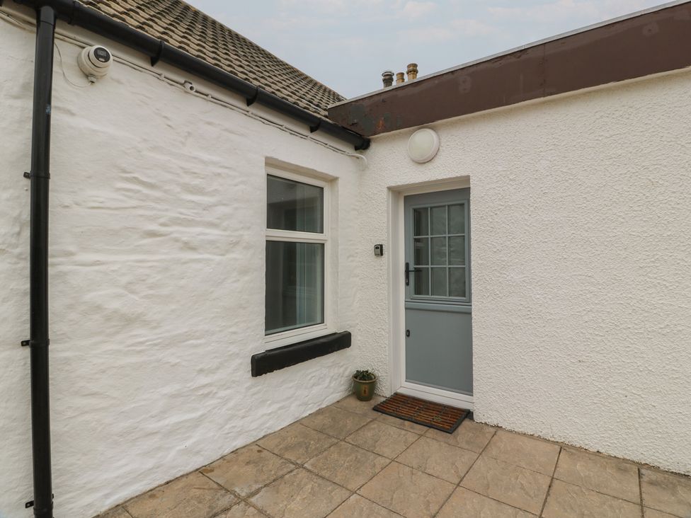 An outdoor area with a door and window at South Kirklauchline Farm Stoneykirk near Sandhead