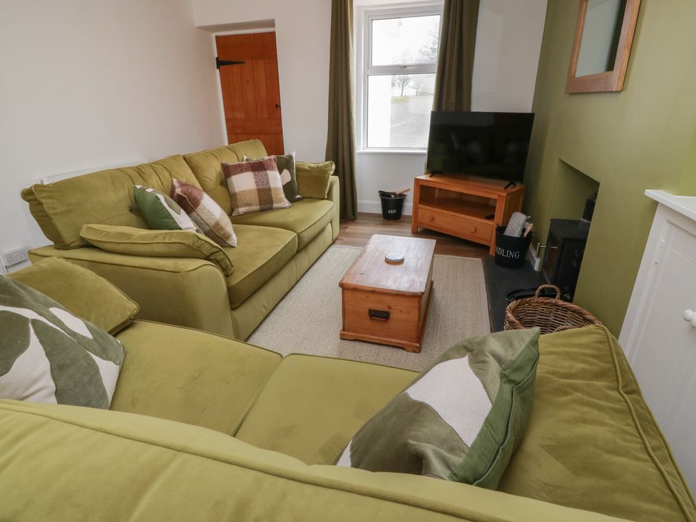 A living room with two sofas and a coffee table at South Kirklauchline Farm Stoneykirk near Sandhead