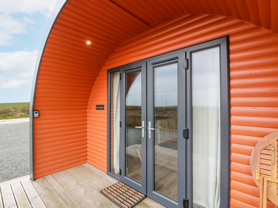 An entrance with a double door and wooden deck at Keith in Stoneykirk near Sandhead