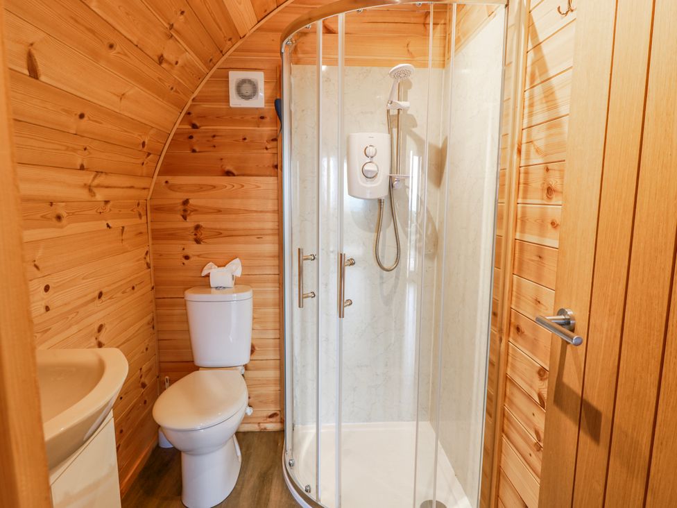 A bathroom with a shower and toilet at Keith in Stoneykirk near Sandhead