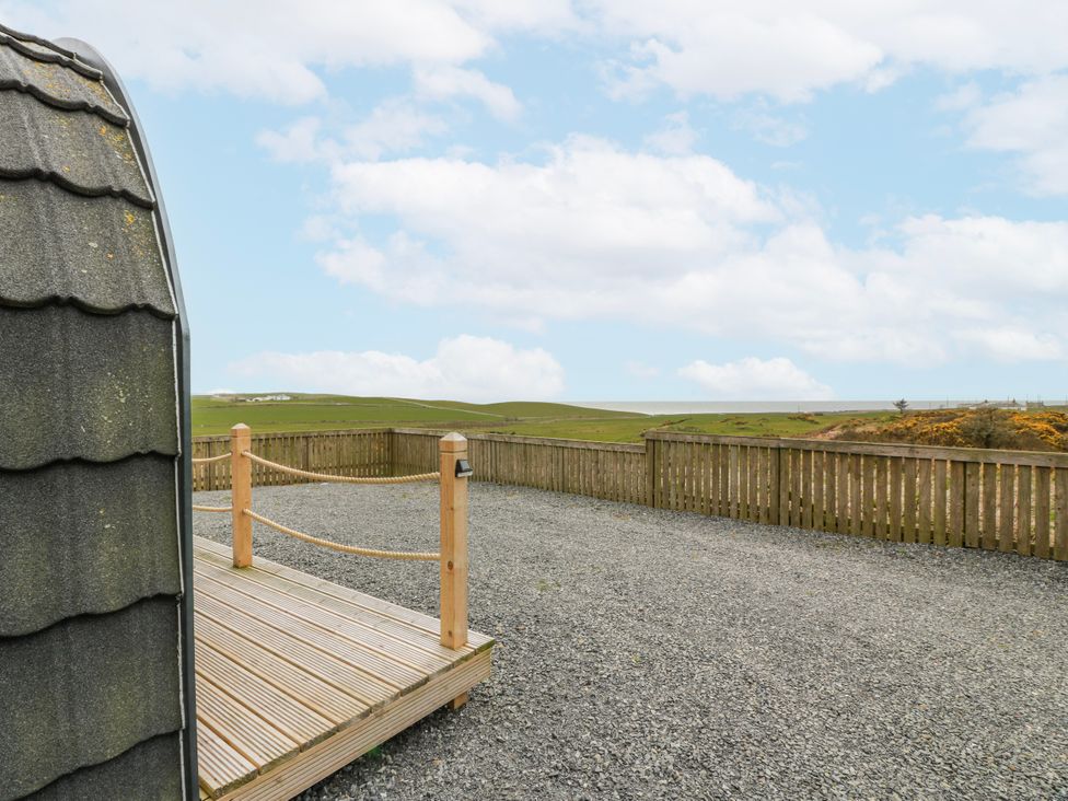 An outdoor area with a wooden deck and gravel at Keith in Stoneykirk near Sandhead