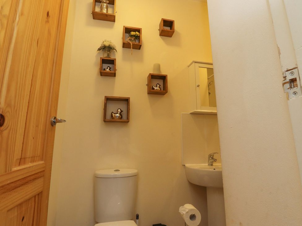 A bathroom with a toilet and sink at 46 Marlborough Road in Accrington