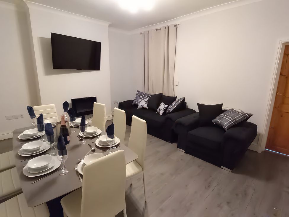 A dining room with table set for dinner at 46 Marlborough Road Accrington