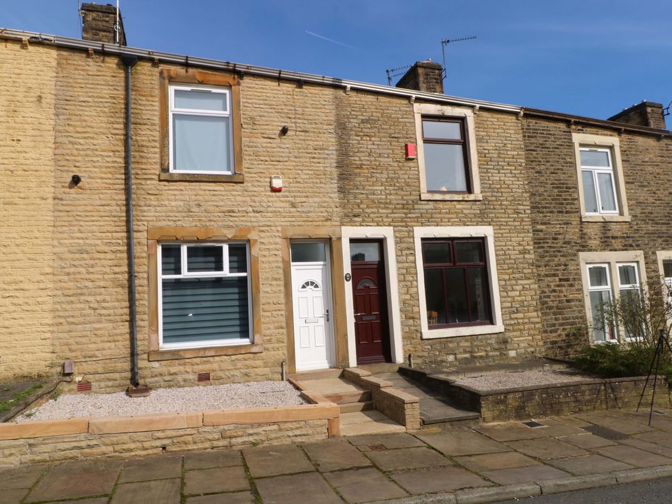 A house exterior with a front door and windows at Victoria Place in Accrington