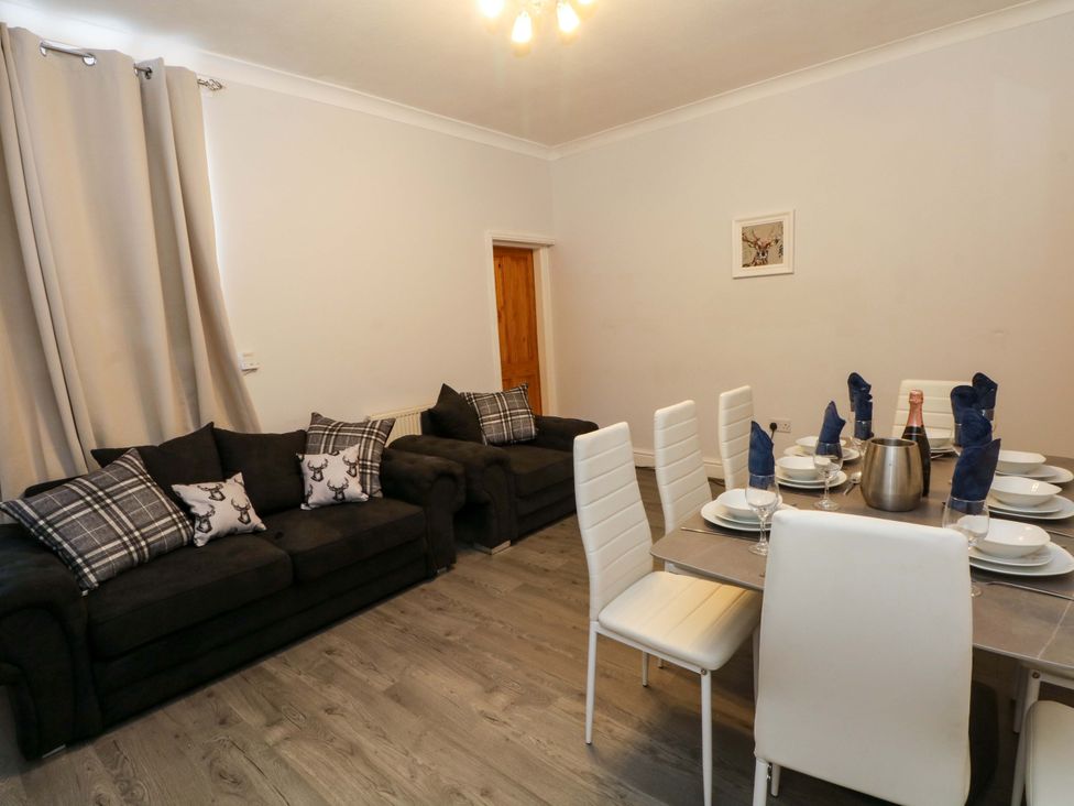A dining room with a table set for dinner at Victoria Place in Accrington