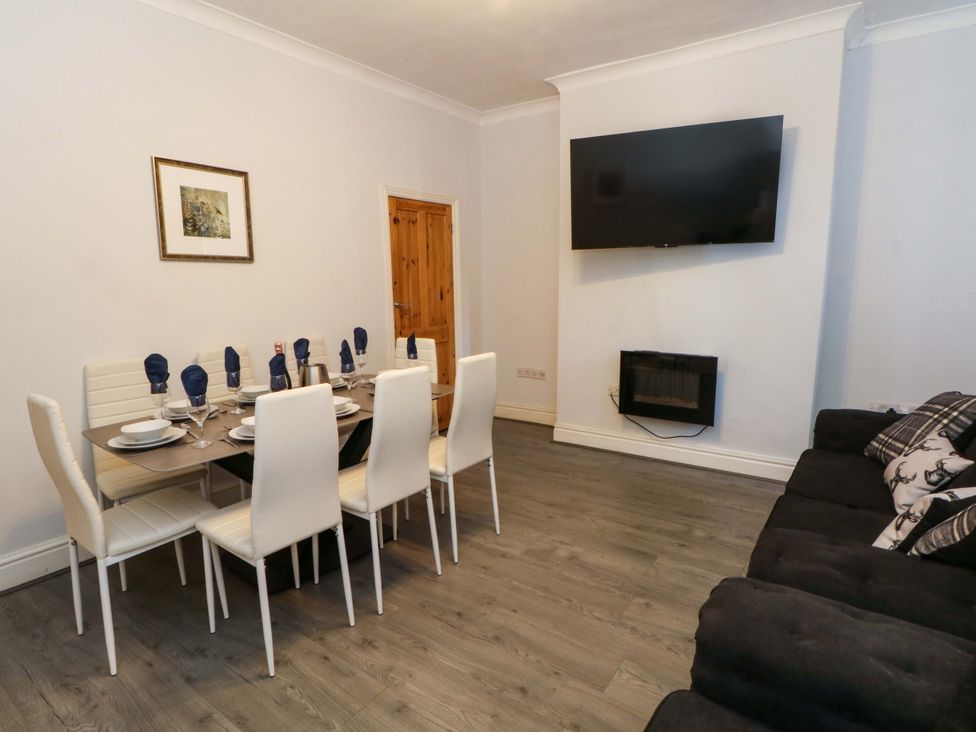 A dining room with a table set for dinner at Victoria Place Accrington