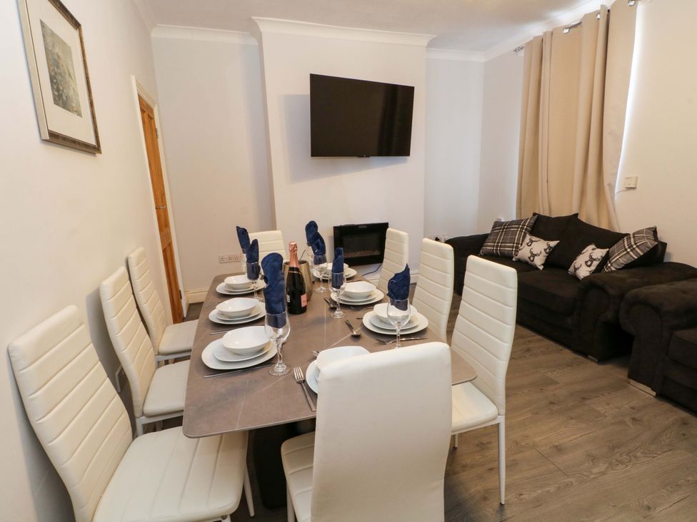 A dining room with a table set for dinner at Victoria Place Accrington