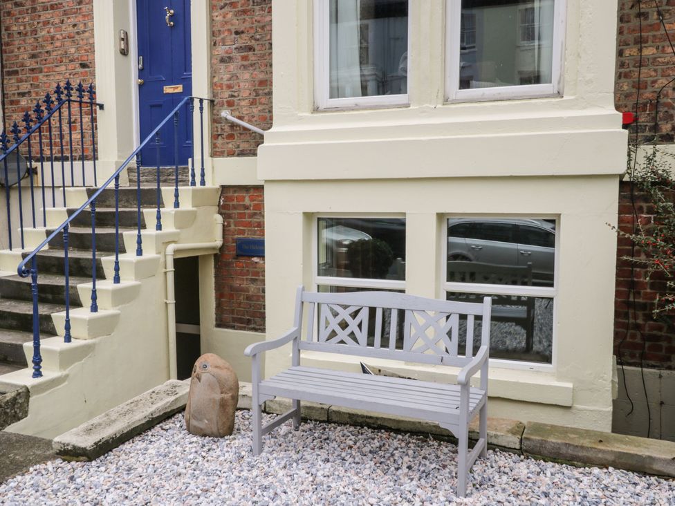 An outdoor area with a bench and stairs at The Hideaway in Whitby