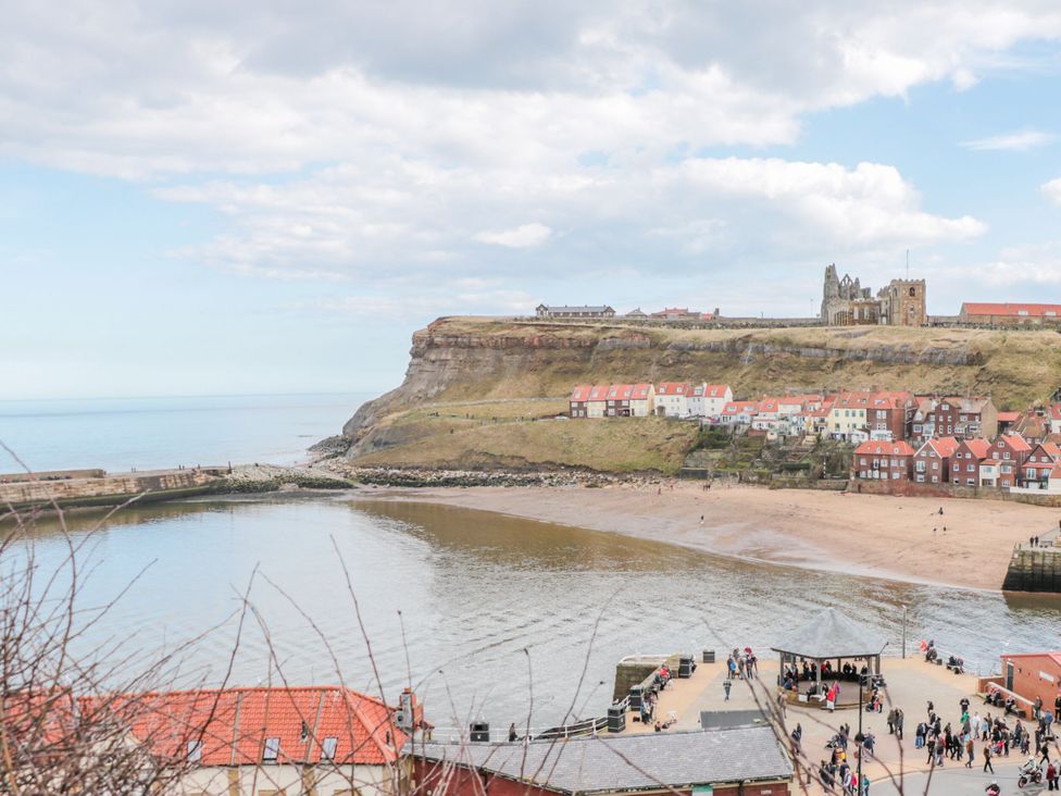 A coastal view with houses and cliffs at The Hideaway in Whitby