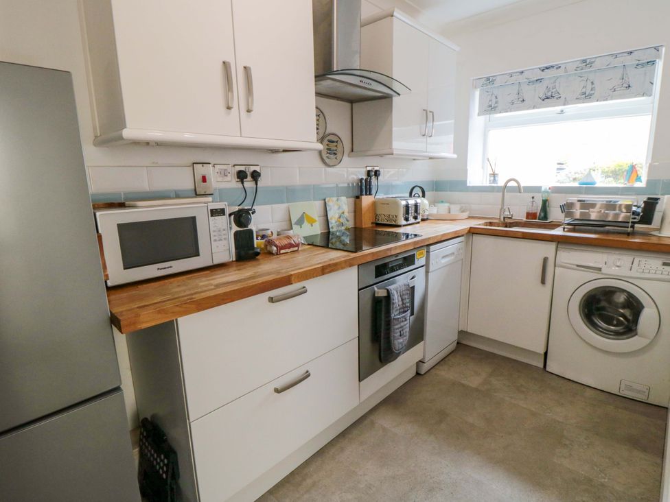 A kitchen with appliances and countertop at The Hideaway in Whitby