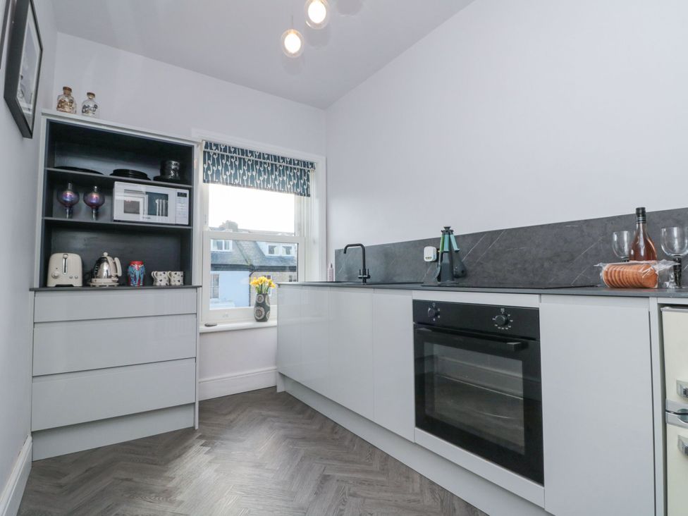 A kitchen with a sink and oven at Cuckoo's Nest in Whitby