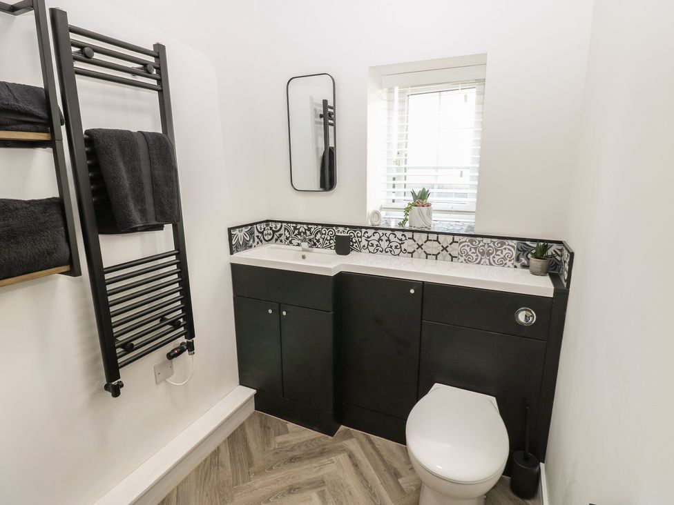 A bathroom with a sink and toilet at 2 Low Road