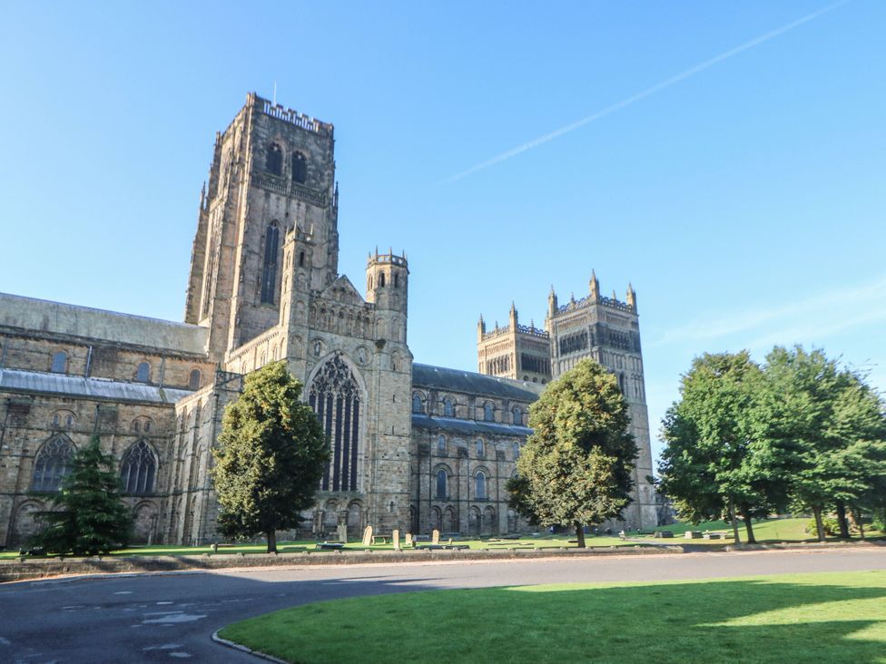 A cathedral with tall towers and trees in the foreground at 2 Low Road