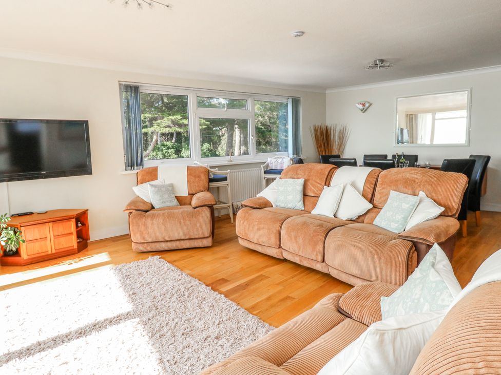 A living room with sofa and television at Flat 17 Golden Gates in Poole