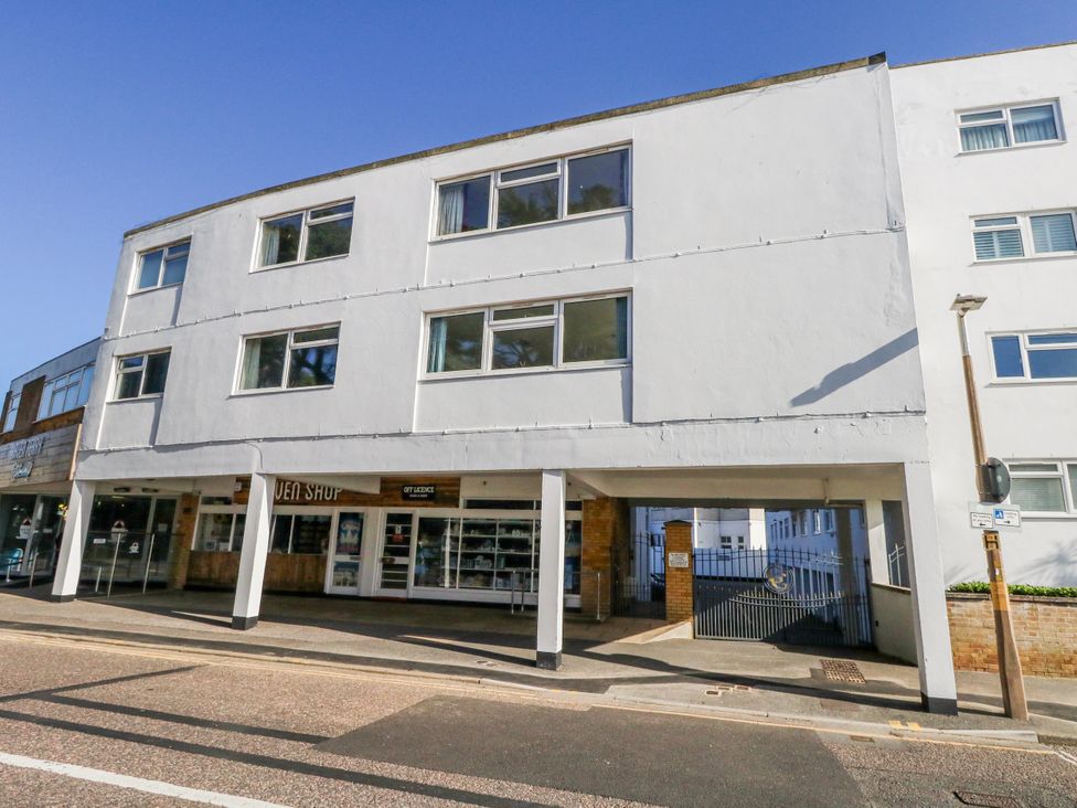 A building with shops and windows at Flat 17 Golden Gates in Poole