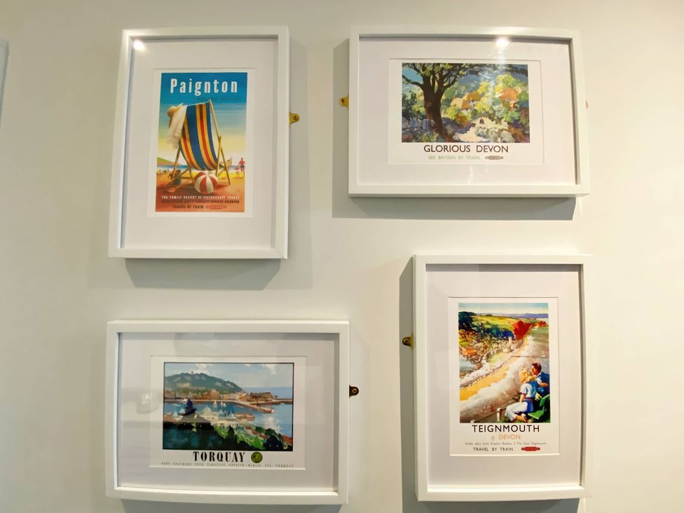 Framed posters of Paignton, Glorious Devon, Torquay, and Teignmouth at 2B Redcliffe in Torquay