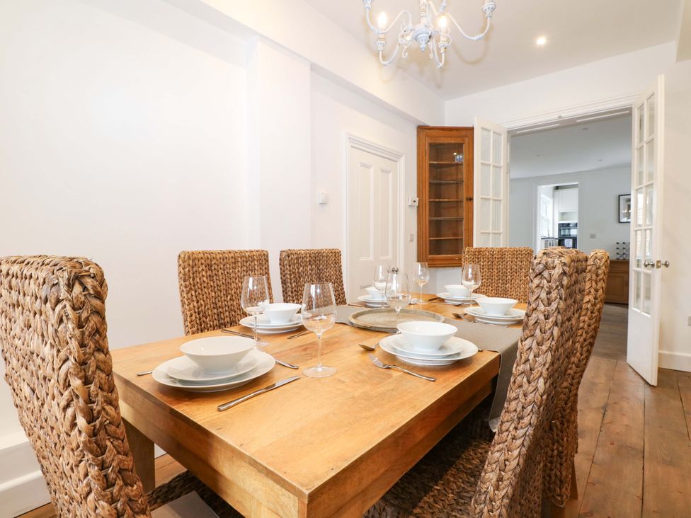 A dining room with a table and chairs at 19 Queen Street Emsworth