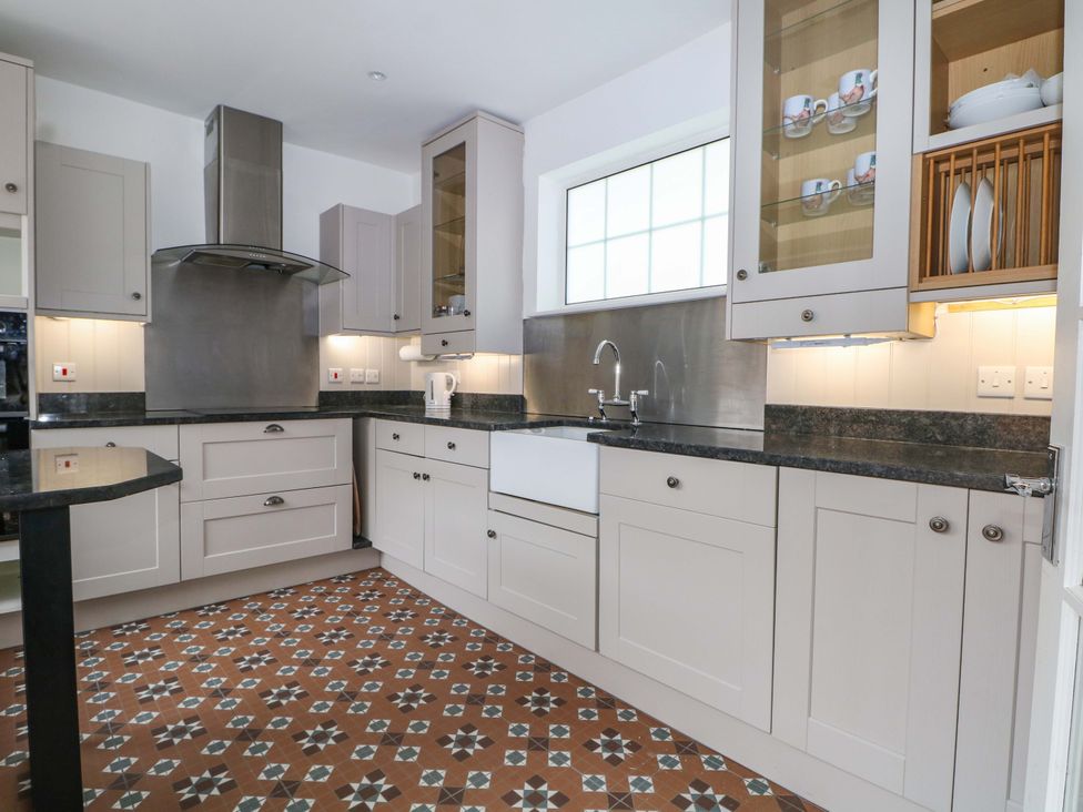 A kitchen featuring cabinets and a sink at 19 Queen Street Emsworth