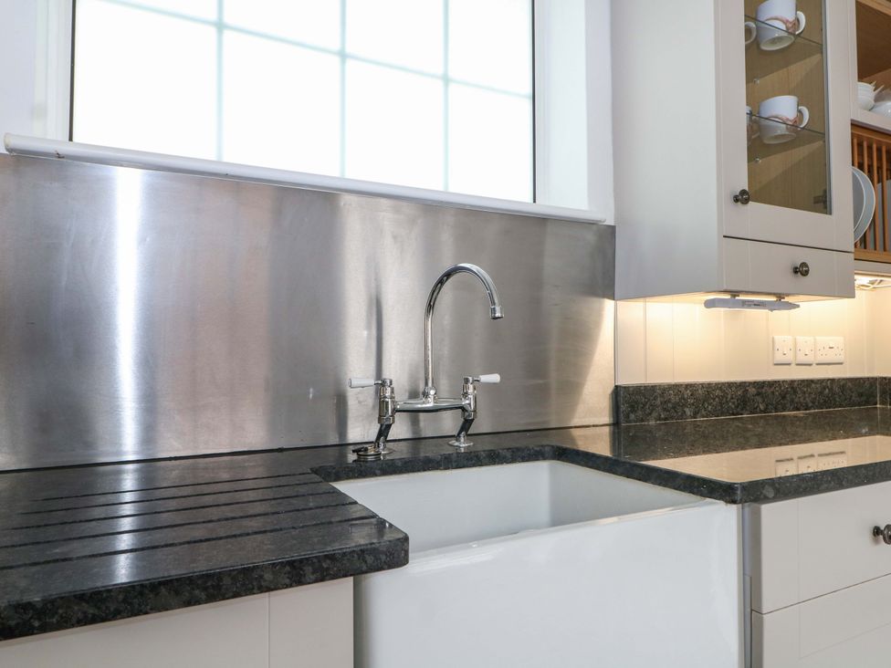 A kitchen featuring a sink and faucet at 19 Queen Street Emsworth