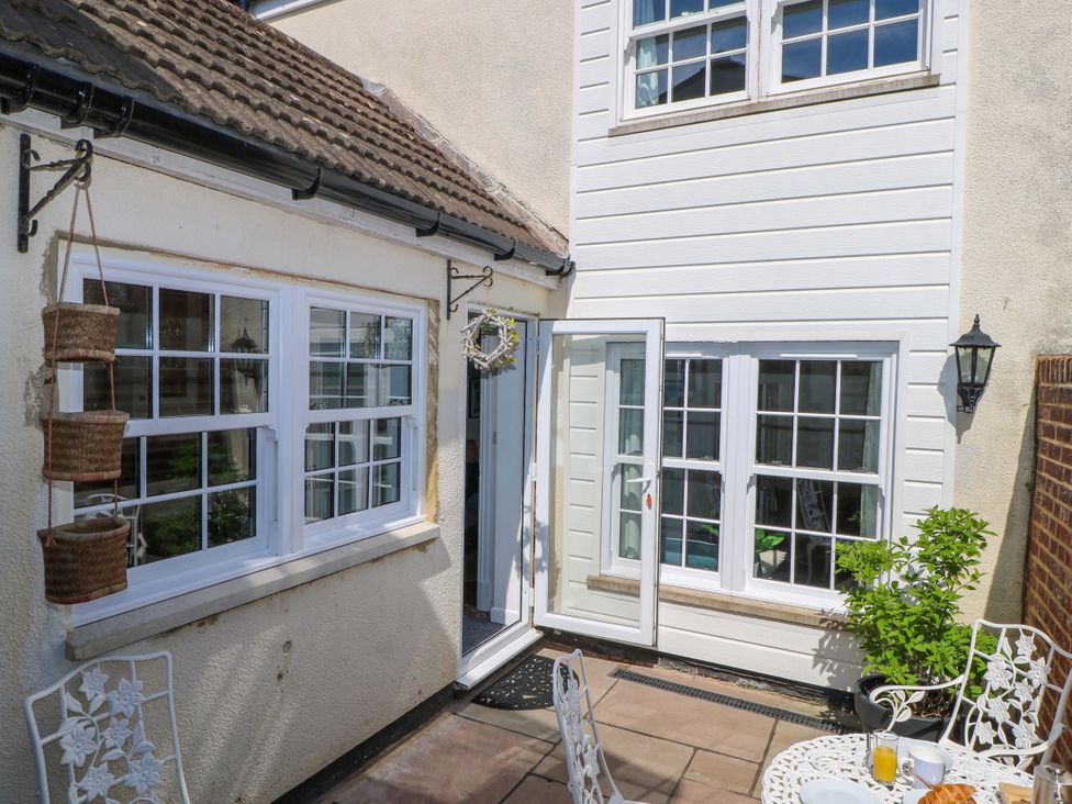 An outdoor area with a door and windows at 19 Queen Street Emsworth