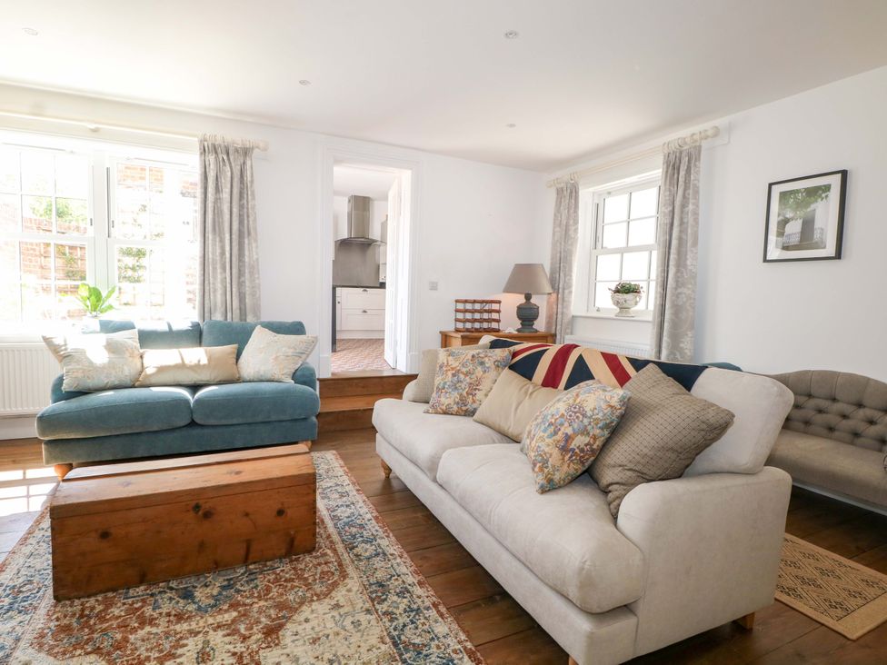A living room with sofas and a coffee table at 19 Queen Street in Emsworth