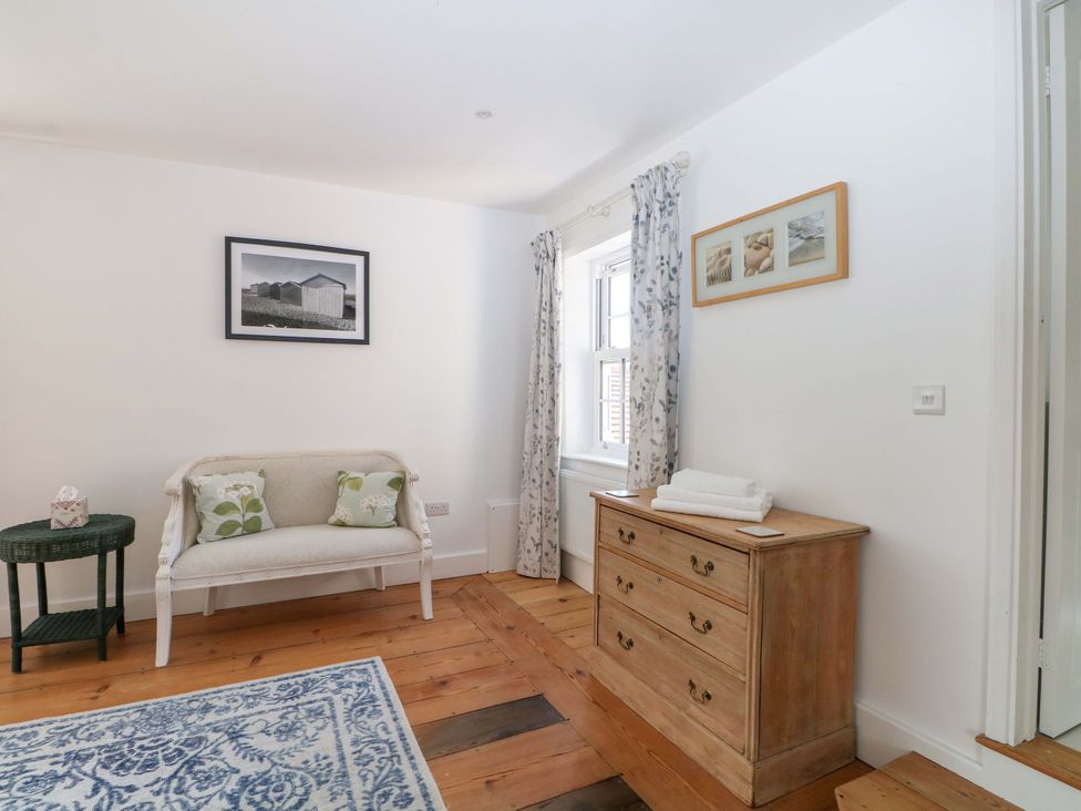 A sitting room with a sofa and a drawer unit at 19 Queen Street Emsworth