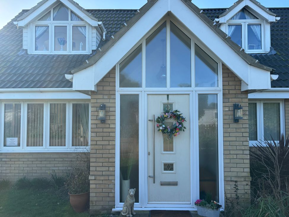 An entrance with a front door and windows at Seaview in Pakefield