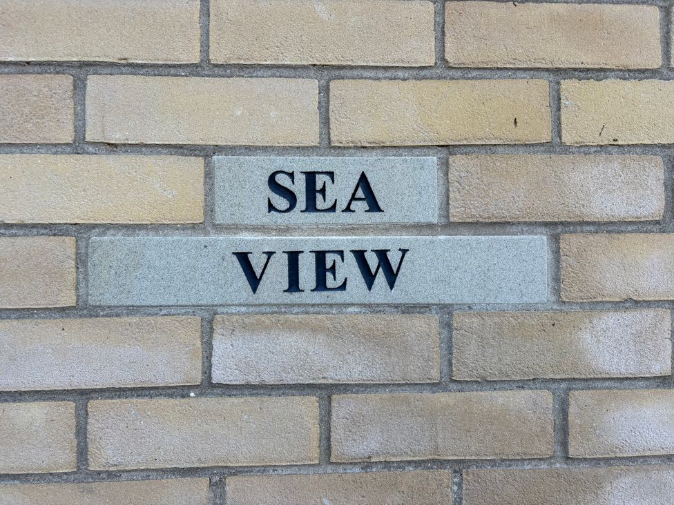 A brick wall with the name Sea View displayed at Seaview, Pakefield