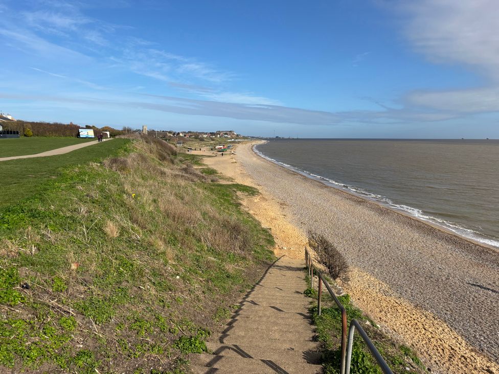 A beach with pebbles and a path at Seaview in Pakefield