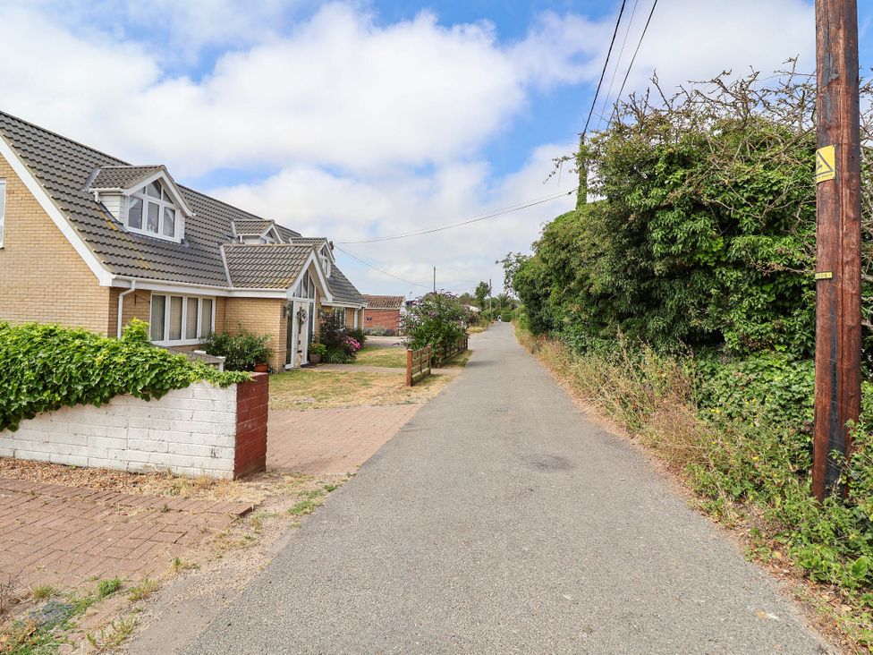 A street view with a house on the side at Seaview in Pakefield