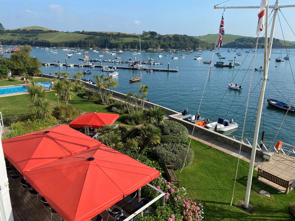 An outdoor area with boats on water and a pool at 24 The Salcombe, Salcombe