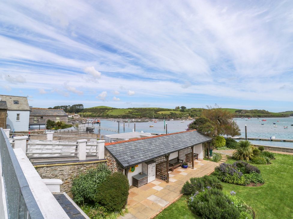 View of garden and water with boats at 24 The Salcombe in Salcombe