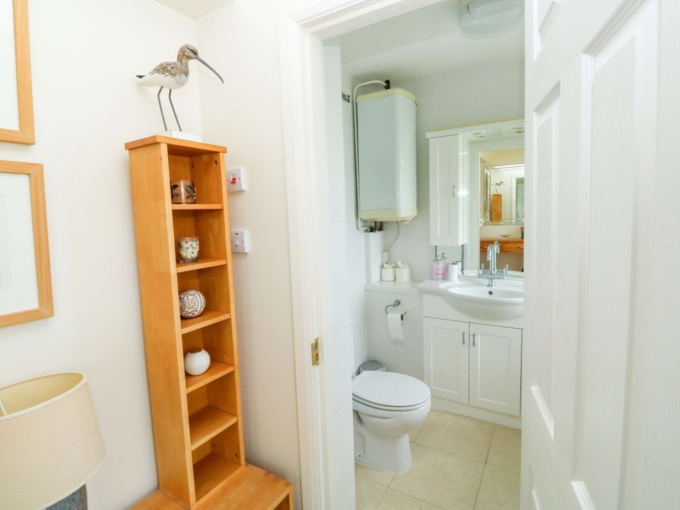 A bathroom with a sink and toilet at 24 The Salcombe in Salcombe