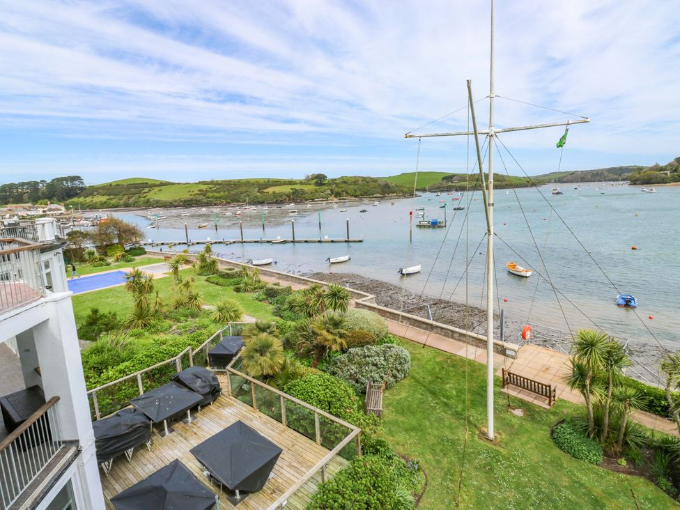 A view of boats and a garden area with a pier at 24 The Salcombe Salcombe