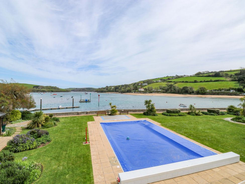 A swimming pool overlooking a water view at 24 The Salcombe in Salcombe