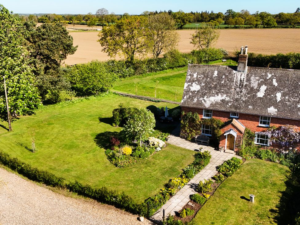 A house with a garden and pathway at Cutbush Farmhouse in Hingham