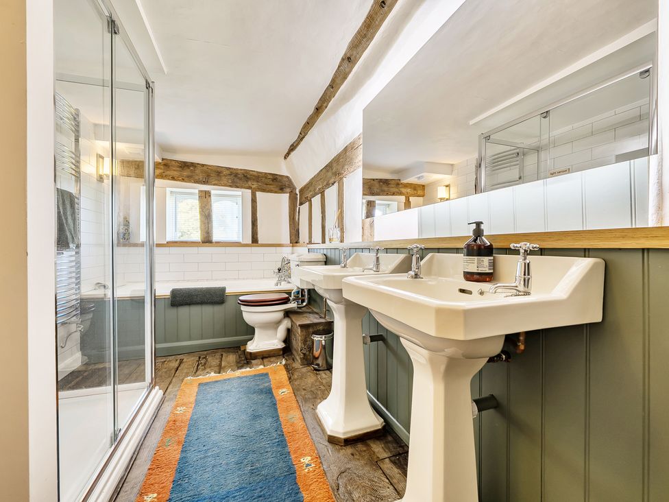 A bathroom with shower and bathtub at Cutbush Farmhouse in Hingham