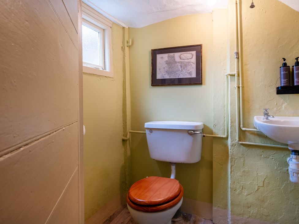 A bathroom with a toilet and sink at Palace Garden Cottage in Bishop Auckland