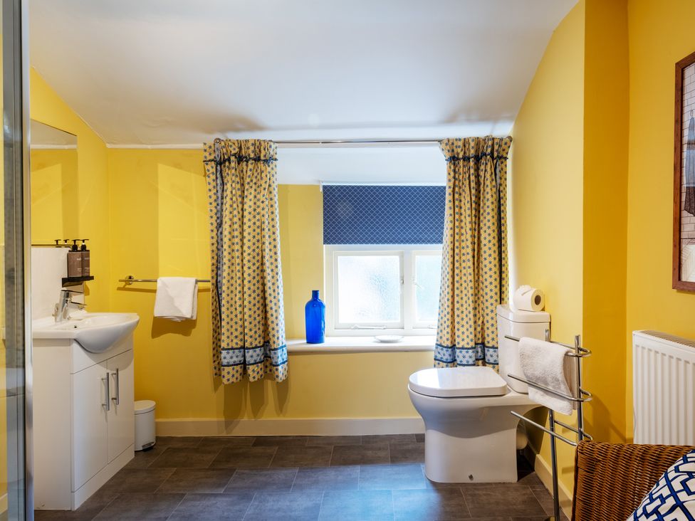 A bathroom with a sink and toilet at Palace Garden Cottage in Bishop Auckland
